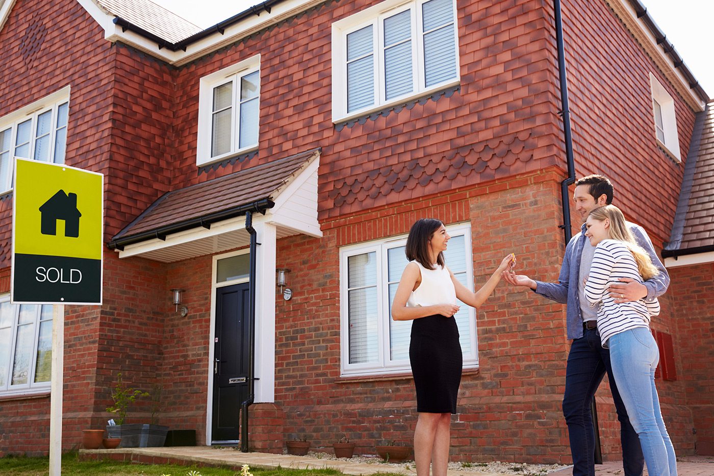 demo-attachment-105-young-couple-collecting-keys-to-new-home-from-PJC4FXU